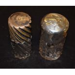 Two silver topped salts bottles