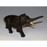 Japanese School (early 20th century), a dark patinated cabinet bronze, of an elephant,