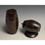 Treen - a Victorian lignum vitae string barrel, mounted horizontally, spreading circular base,