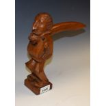 An early 20th century oak table top lever-action figural novelty nutcracker,