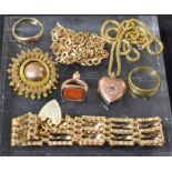 A 9ct gold gate link bracelet; a 9ct gold necklace; a gold metal target brooch; a 9ct gold ring;