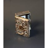 An 18th century silver on copper snuff box, the hinged cover embossed with foliate scrolls,
