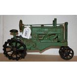 A vintage cast iron John Deere model tractor