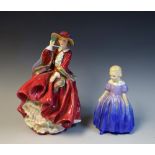 A Royal Doulton figure, Top O' The Hill, HN1834; another, Marie,