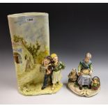 Ceramics - a continental pottery figural vase, tall oval body painted with farm buildings and track,