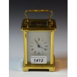 A lacquered brass carriage timepiece,