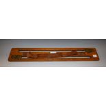 Shooting - an Edwardian oak game carrirer, brass caps, leather carrying strap, 55cm wide,