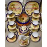 A desert scene tea service, to include 12 cups, saucers, plates, teapot and stand, jug,