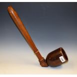 A 19th century novelty model of an oversized pipe, possibly a shop sign, turned shaft,