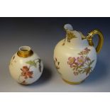 A Royal Worcester flatback jug, printed and painted with flower sprigs, on a blush ivory ground,