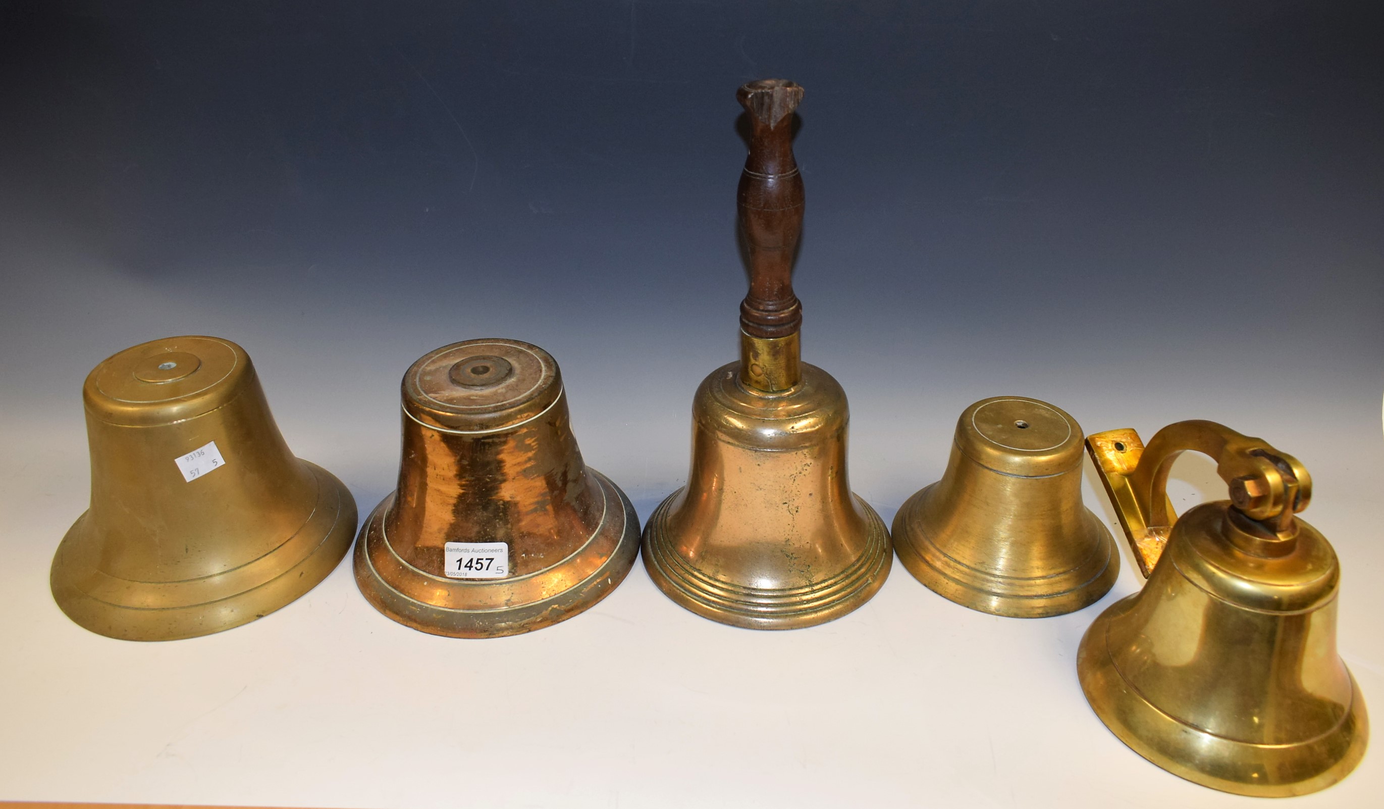 Bells - a late 19th/early 20th century hand bell, bronze bowl, brass clapper, turned wooden handle,