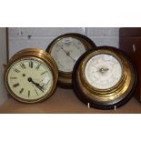 A ship's brass bulkhead clock;