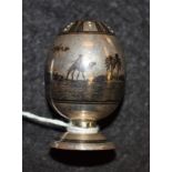 A silver niello pepperette, decorated with Middle Eastern scenes,