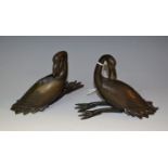 A Chinese dark patinated bronze censer, cast as a goose, with head turned back, 13cm long,
