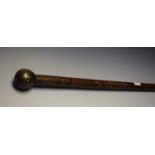 An Indian hardwood and pique walking cane, globular pommel, inlaid with silvered pinwork, 84.