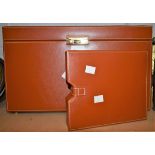 A large tan leather jewellery box, fitted interior to include drawers with necklace pads,