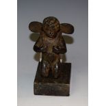 Continental School (19th century), a dark patinated bronze, of a kneeling putto,