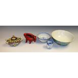 A Chinese inkwell; a blue and white tea bowl; a resin red lacquer type tripod libation type cup;