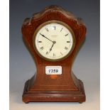 An Edwardian mahogany inlaid mantel timepiece, J H Burnett, Lincoln,