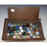 A collection of 19th century glass marbles, various types and sizes, oak box with sliding cover,