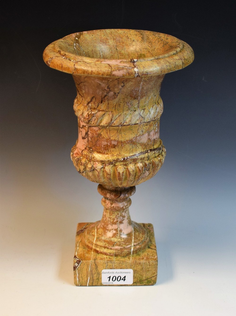A Grand Tour style 'scagiola' stone campana urn, ropetwist girdle, square base, 29.