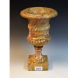 A Grand Tour style 'scagiola' stone campana urn, ropetwist girdle, square base, 29.