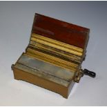 An early 20th century Evans & Co patent mahogany and brass cigarette making machine, hinged cover,