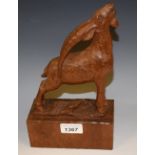 A Black Forest type carving, of a goat on a rocky outcrop, rectangular base,