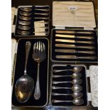 A set of six silver cake forks; a set of six silver teaspoons;