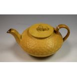 An early 19th century Wedgwood caneware teapot, basket weave moulding,