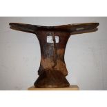 Tribal Art - an African two-tone hardwood headrest, shaped dished plateau, domed base,