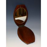 A late 19th century campaign type mahogany bowed rectangular shaving mirror,