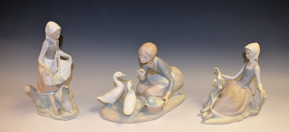A Lladro figure group, Food For Ducks, matte finish; others, Shepherdess With Dove,