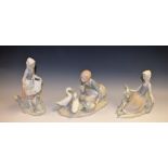 A Lladro figure group, Food For Ducks, matte finish; others, Shepherdess With Dove,