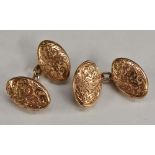 A pair of 9ct gold oval engraved and embossed oval panelled cufflinks, marked 10ct, W J H, 5.