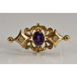 A Victorian neoclassical style diamond and amethyst brooch, oval deep purple amethyst,