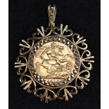 A gold sovereign pendant, London mint 1910, mounted within a shaped 9ct gold frame, Sheffield 1976,