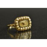 A 19th century hair work and seed pearl mourning ring,