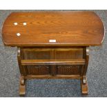 An Old Charm oak magazine rack/occasional table model