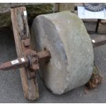 A gritstone grindstone.