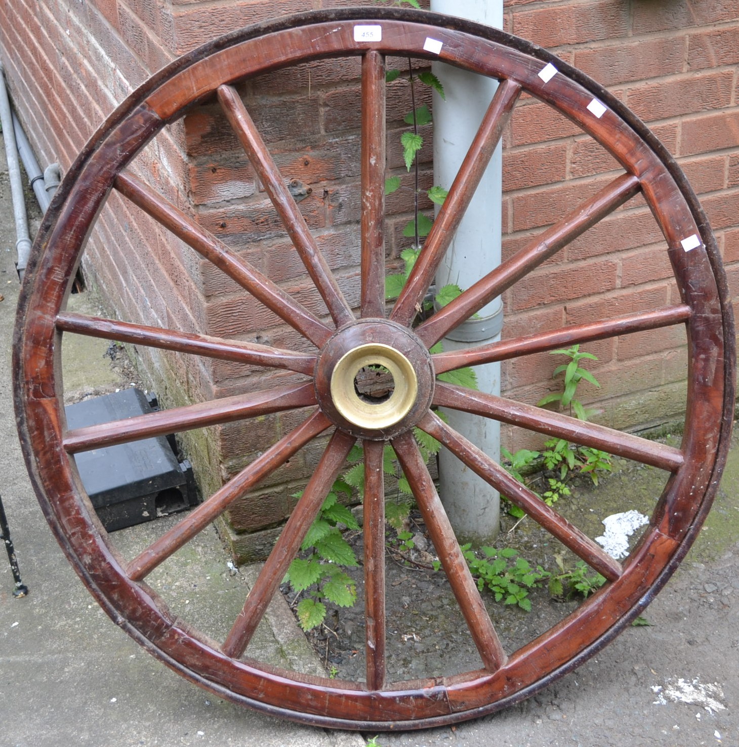 A steel bound cart wheel, the steel channelled to take a tyre. 108cm diameter.
