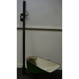 Architectural salvage - an Adjustaflood flood light with green and white enamelled hood,