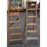 Two sets of vintage wooden step ladders, one six step,