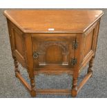 An oak side cupboard,