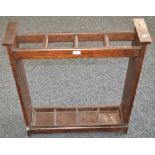 An oak arts and crafts walking stick stand,