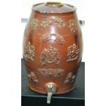 A large salt glazed stoneware barrel, with metal tap,