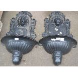 A pair of cast iron lion head wall fountains, approx.