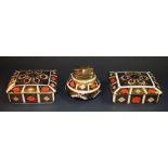 Royal Crown Derby - a pair of 1128 lidded trinket boxes;