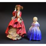 A Royal Doulton figure, Top O' The Hill, HN1834; another, Marie,