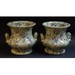 A pair of late 19th century two handled ogee pottery planters, printed with flowers, c.